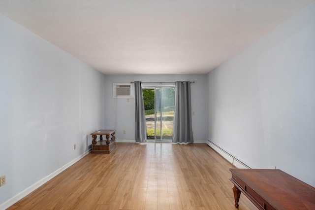 616 Lynn Ave Unit 21, Kalamazoo, MI 49008 - unfurnished room featuring light wood finished floors, an AC wall unit, and a baseboard heating unit