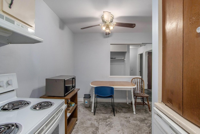 616 Lynn Ave Unit 21, Kalamazoo, MI 49008 - dining space featuring a ceiling fan and baseboards