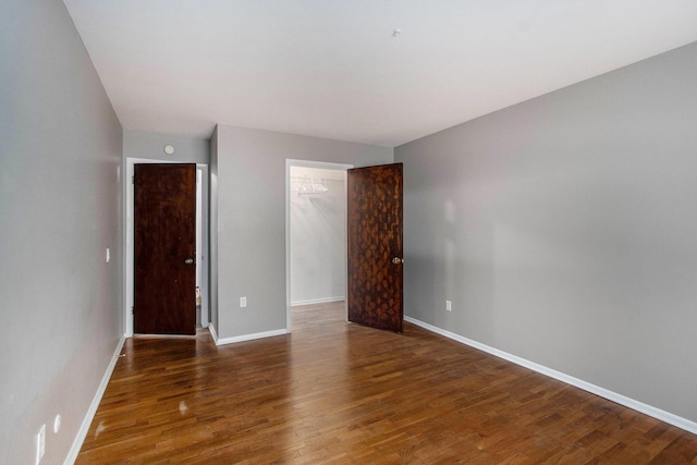 616 Lynn Ave Unit 21, Kalamazoo, MI 49008 - unfurnished bedroom with wood finished floors