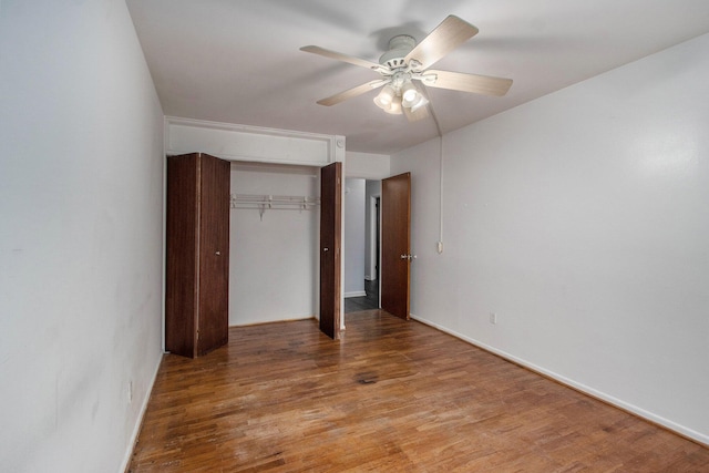 616 Lynn Ave Unit 21, Kalamazoo, MI 49008 - unfurnished bedroom with a closet, light wood-style floors, and a ceiling fan