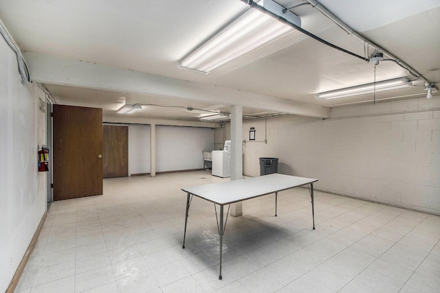 616 Lynn Ave Unit 21, Kalamazoo, MI 49008 - finished below grade area with washer / clothes dryer, light floors, and concrete block wall