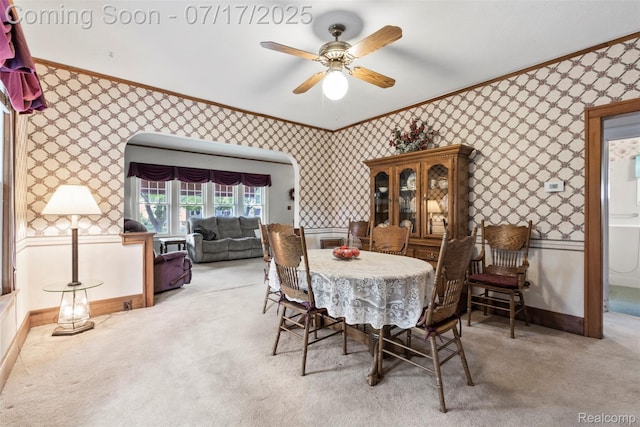 2006 N Connecticut Ave, Royal Oak, MI 48073 - dining room featuring ornamental molding, wallpapered walls, carpet, and ceiling fan