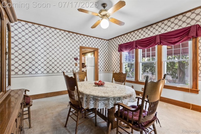 2006 N Connecticut Ave, Royal Oak, MI 48073 - carpeted dining area with ornamental molding, wallpapered walls, and ceiling fan