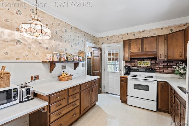 2006 N Connecticut Ave, Royal Oak, MI 48073 - kitchen featuring white range with electric cooktop, under cabinet range hood, stainless steel microwave, light countertops, and a wainscoted wall