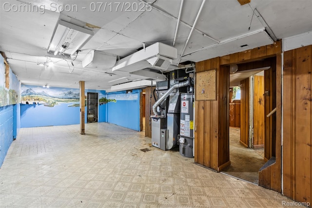 2006 N Connecticut Ave, Royal Oak, MI 48073 - basement featuring water heater, tile patterned floors, heating unit, and wood walls