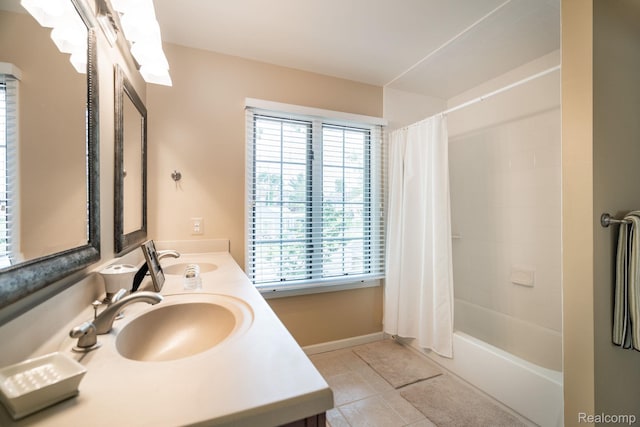 3831 Woodland Dr, Highland, MI 48356 - full bath with double vanity, tile patterned flooring, and shower / tub combo with curtain