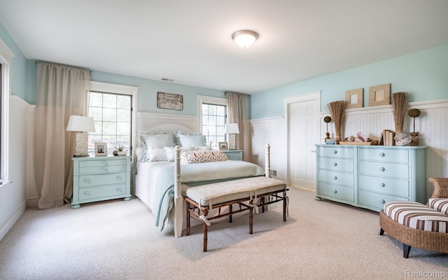 3831 Woodland Dr, Highland, MI 48356 - bedroom with a wainscoted wall and light carpet