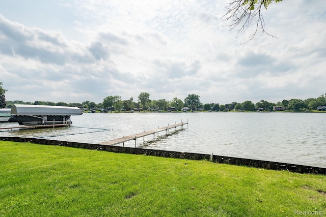 3831 Woodland Dr, Highland, MI 48356 - dock with a water view and a yard