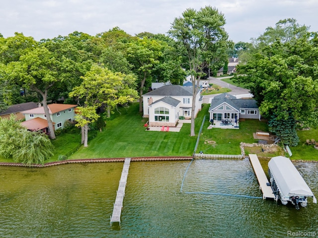 3831 Woodland Dr, Highland, MI 48356 - dock featuring a water view, a lawn, and a patio