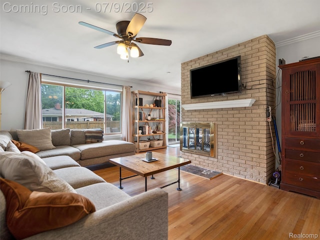 32000 Coronet Dr, Farmington, MI 48334 - living room featuring a fireplace, wood finished floors, a ceiling fan, and ornamental molding