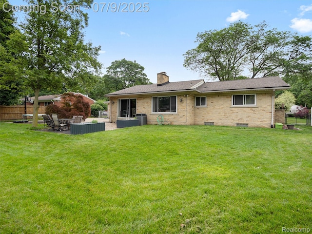 32000 Coronet Dr, Farmington, MI 48334 - back of property with a patio, a chimney, brick siding, and crawl space