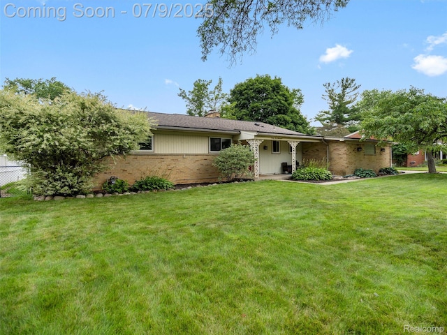 32000 Coronet Dr, Farmington, MI 48334 - view of front of property featuring brick siding and a chimney