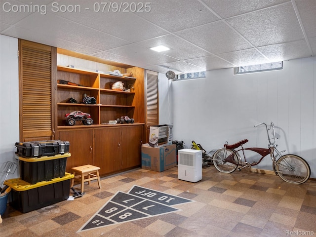 32000 Coronet Dr, Farmington, MI 48334 - finished below grade area featuring tile patterned floors, a paneled ceiling, and wooden walls