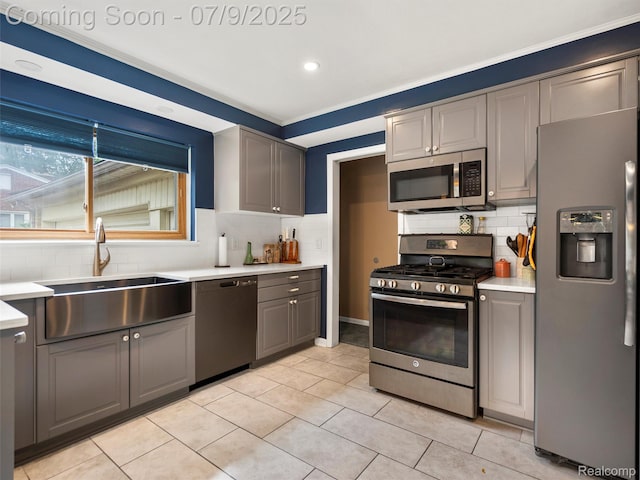 32000 Coronet Dr, Farmington, MI 48334 - kitchen with stainless steel appliances, gray cabinetry, tasteful backsplash, light countertops, and recessed lighting