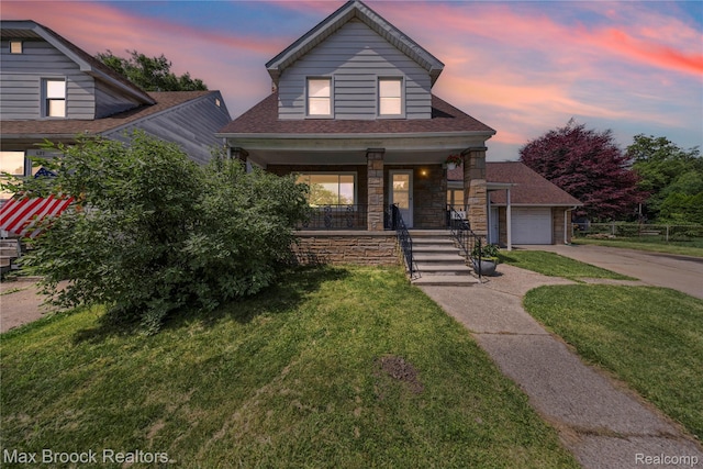 643 Spencer St, Ferndale, MI 48220 - view of front of property with covered porch, concrete driveway, a front lawn, stone siding, and a shingled roof