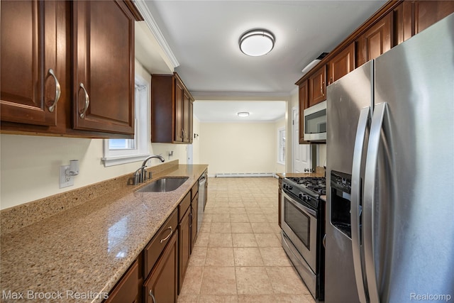 643 Spencer St, Ferndale, MI 48220 - kitchen with appliances with stainless steel finishes, light stone countertops, plenty of natural light, a baseboard radiator, and crown molding