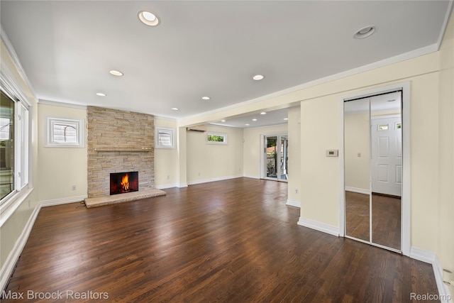 643 Spencer St, Ferndale, MI 48220 - unfurnished living room with a stone fireplace, dark wood-style flooring, ornamental molding, and recessed lighting