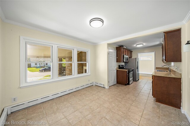 643 Spencer St, Ferndale, MI 48220 - kitchen featuring appliances with stainless steel finishes, a baseboard heating unit, ornamental molding, dark brown cabinets, and light stone countertops