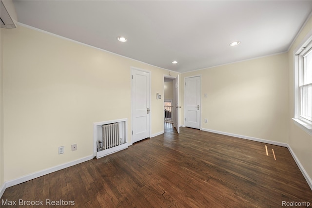 643 Spencer St, Ferndale, MI 48220 - empty room with a wall mounted AC, wood finished floors, recessed lighting, and ornamental molding