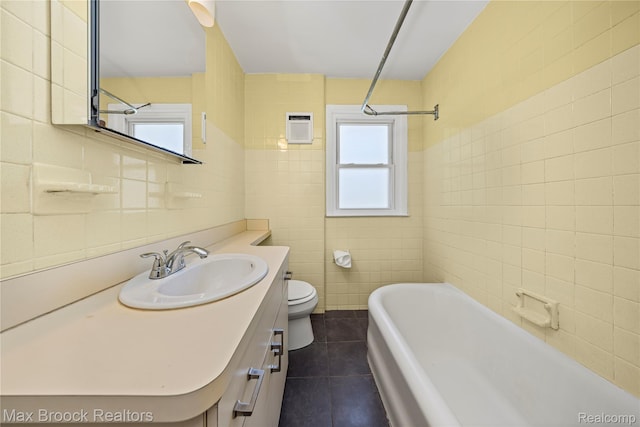 643 Spencer St, Ferndale, MI 48220 - full bath featuring tile walls, tile patterned flooring, plenty of natural light, a bath, and vanity