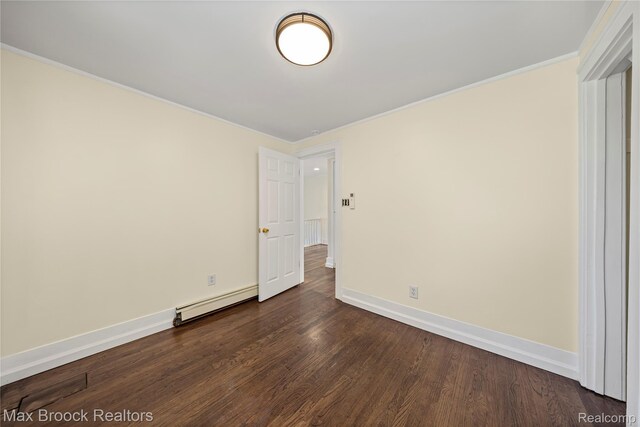 643 Spencer St, Ferndale, MI 48220 - empty room featuring baseboard heating, dark wood finished floors, and crown molding