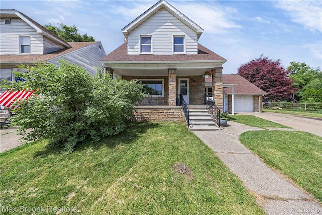 643 Spencer St, Ferndale, MI 48220 - view of front of house with covered porch, stone siding, a front lawn, roof with shingles, and concrete driveway