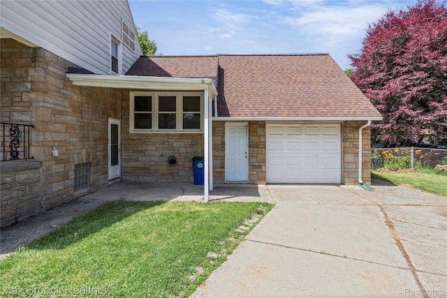 643 Spencer St, Ferndale, MI 48220 - view of front of property with stone siding, roof with shingles, a garage, and driveway