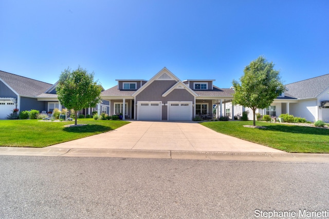 675 Terrace Point Dr, Muskegon, MI 49440 - view of front of house with a garage, a front lawn, and concrete driveway
