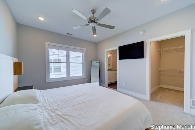 675 Terrace Point Dr, Muskegon, MI 49440 - bedroom featuring carpet flooring, recessed lighting, a spacious closet, a ceiling fan, and ensuite bath