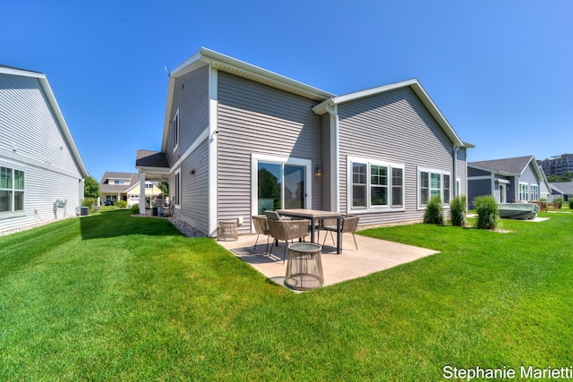 675 Terrace Point Dr, Muskegon, MI 49440 - rear view of house featuring a patio area and a yard
