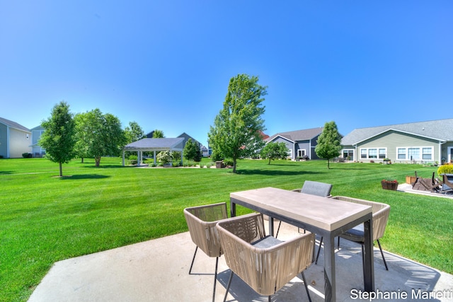 675 Terrace Point Dr, Muskegon, MI 49440 - view of patio featuring a gazebo, outdoor dining area, and a residential view