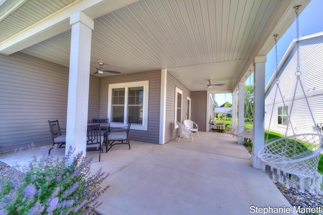675 Terrace Point Dr, Muskegon, MI 49440 - view of patio featuring a ceiling fan and outdoor dining space