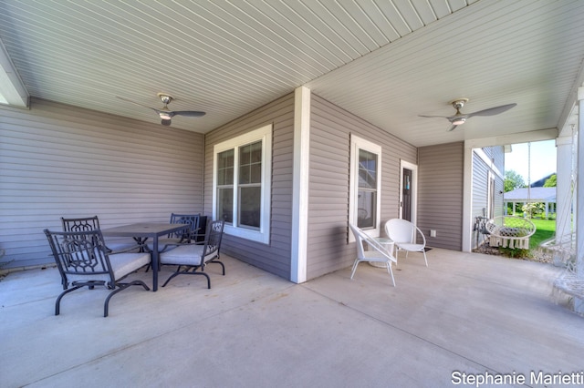 675 Terrace Point Dr, Muskegon, MI 49440 - view of patio with a ceiling fan and outdoor dining space