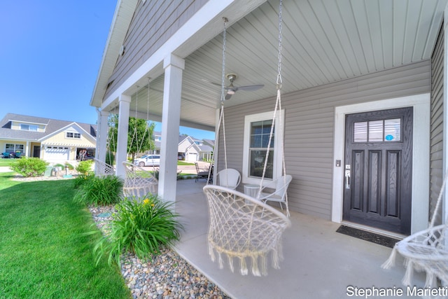 675 Terrace Point Dr, Muskegon, MI 49440 - porch with a yard, a ceiling fan, and a residential view