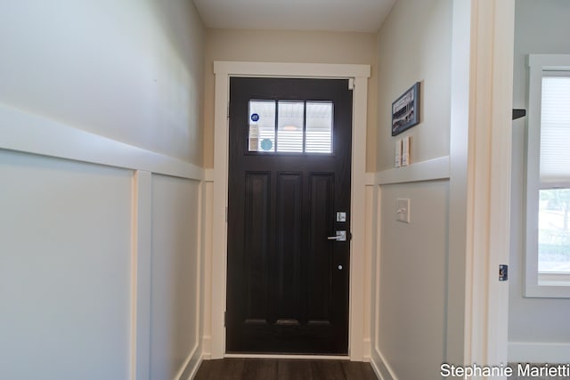 675 Terrace Point Dr, Muskegon, MI 49440 - doorway to outside with healthy amount of natural light and dark wood-type flooring