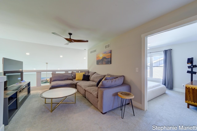 675 Terrace Point Dr, Muskegon, MI 49440 - carpeted living area with ceiling fan and baseboards