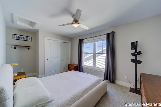 675 Terrace Point Dr, Muskegon, MI 49440 - bedroom with attic access, a closet, a ceiling fan, and carpet