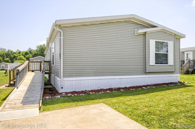 491 Harrison Dr, Davison, MI 48423 - view of side of property with a yard and a patio