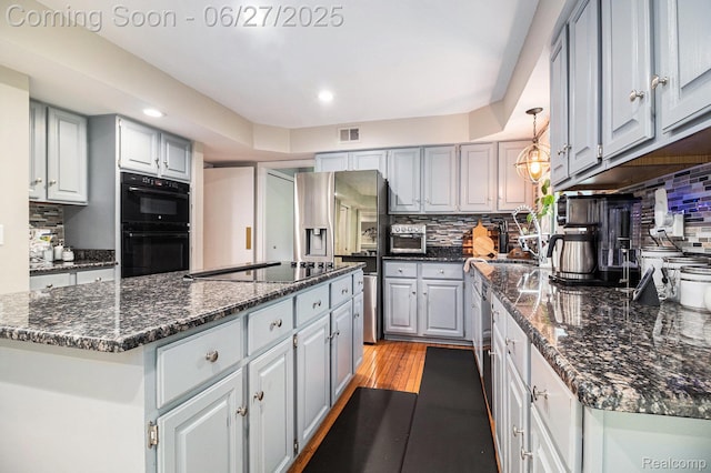 4469 Tanbark St, Bloomfield Hills, MI 48302 - kitchen featuring black appliances, gray cabinetry, a center island, and recessed lighting