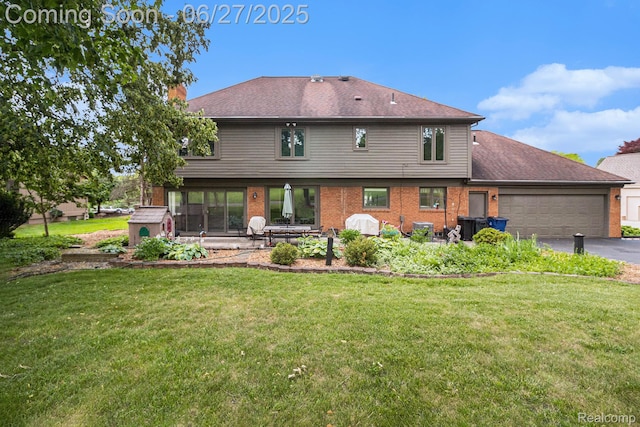 4469 Tanbark St, Bloomfield Hills, MI 48302 - rear view of property featuring driveway, an attached garage, brick siding, and a yard