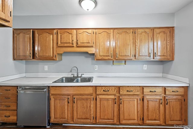 1935 Carmanbrook Pkwy, Flint, MI 48507 - kitchen with stainless steel dishwasher, light countertops, and brown cabinetry