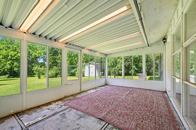 1935 Carmanbrook Pkwy, Flint, MI 48507 - unfurnished sunroom featuring healthy amount of natural light and view of wooded area