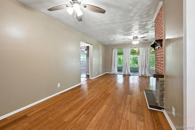 1935 Carmanbrook Pkwy, Flint, MI 48507 - spare room featuring ceiling fan, wood finished floors, and a textured ceiling
