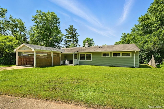 1935 Carmanbrook Pkwy, Flint, MI 48507 - ranch-style home with a chimney, a carport, driveway, and a porch