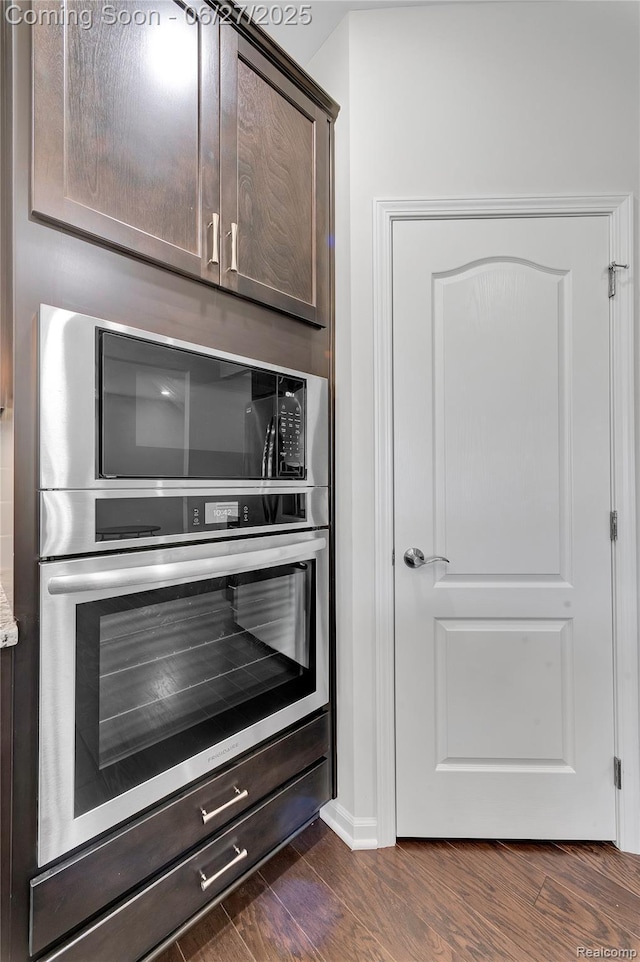 38731 Chasewood Ct, Farmington Hills, MI 48335 - bar with dark wood-type flooring and black microwave