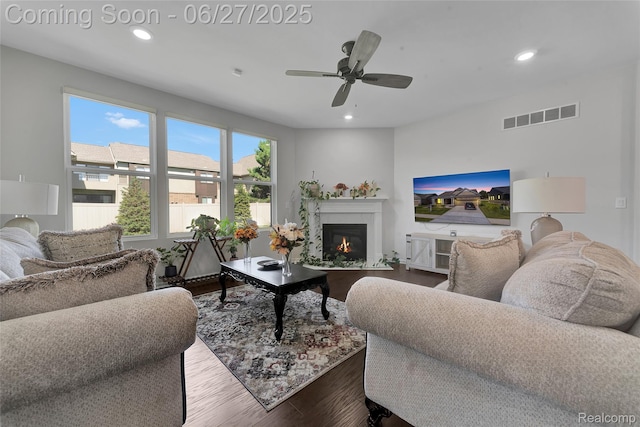 38731 Chasewood Ct, Farmington Hills, MI 48335 - living room with dark wood-style floors, recessed lighting, a glass covered fireplace, and ceiling fan