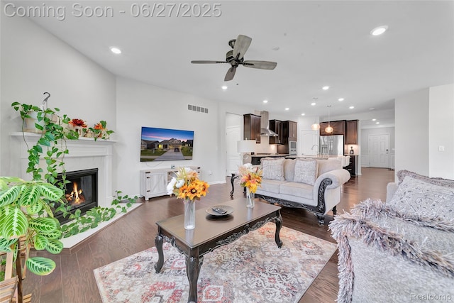 38731 Chasewood Ct, Farmington Hills, MI 48335 - living room with ceiling fan, a glass covered fireplace, recessed lighting, and wood finished floors