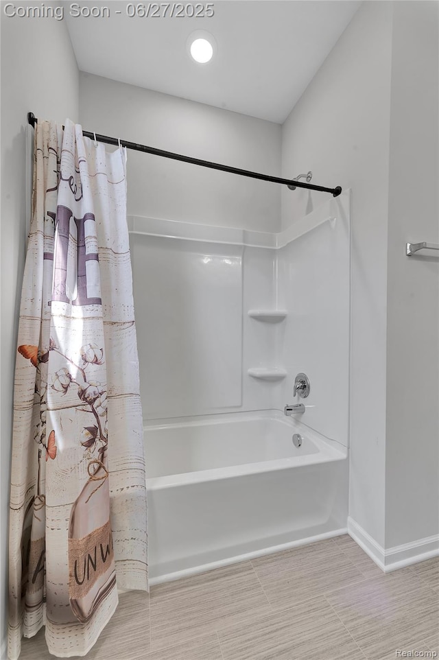 38731 Chasewood Ct, Farmington Hills, MI 48335 - bathroom featuring shower / bath combination with curtain and baseboards