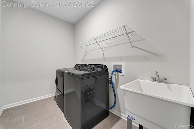 38731 Chasewood Ct, Farmington Hills, MI 48335 - laundry room with independent washer and dryer and light wood-type flooring