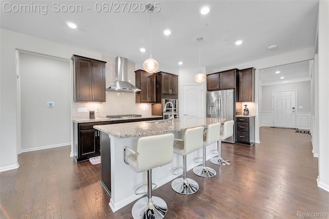 38731 Chasewood Ct, Farmington Hills, MI 48335 - kitchen featuring wall chimney range hood, appliances with stainless steel finishes, backsplash, dark brown cabinetry, and recessed lighting